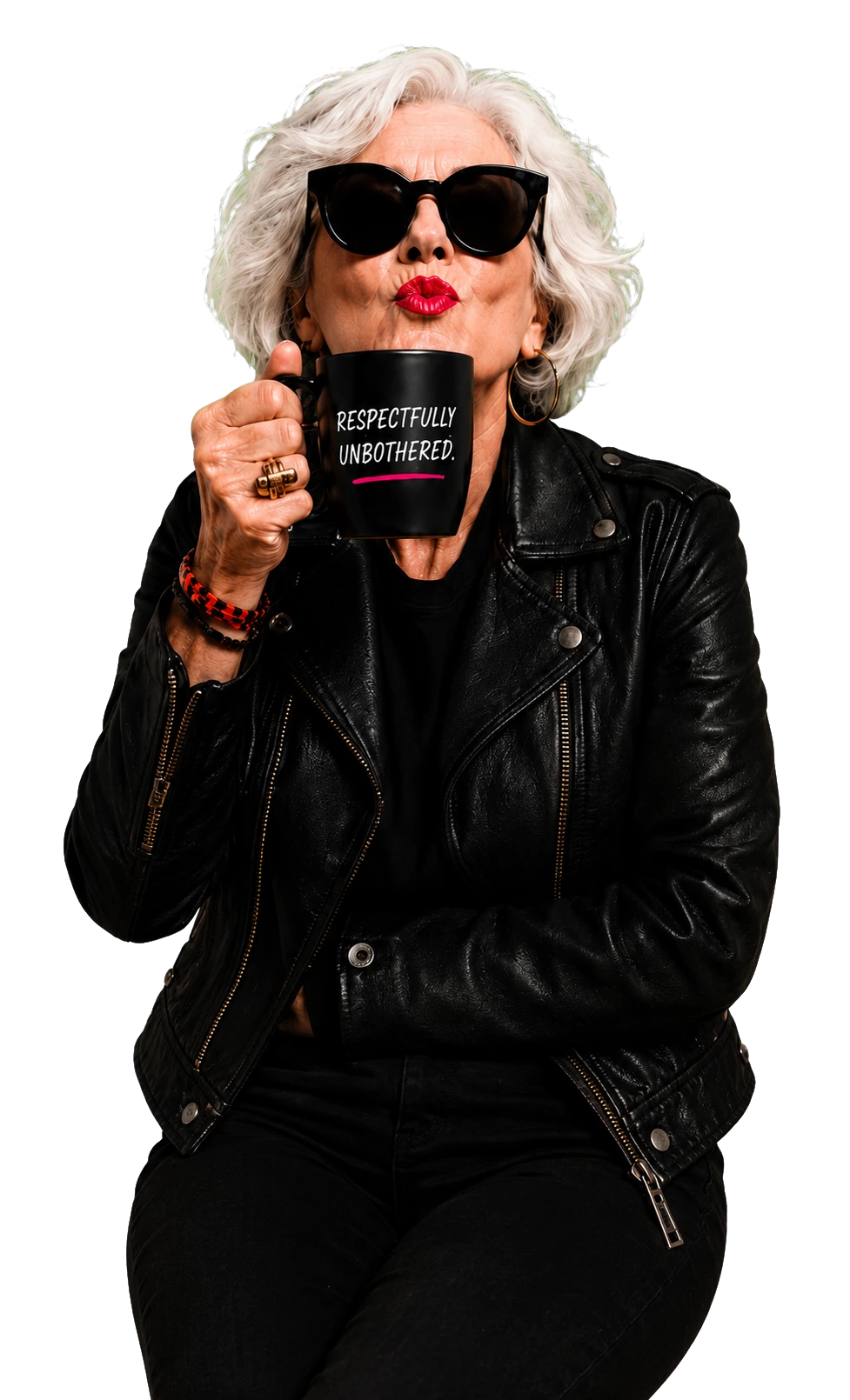 A silver-haired woman in sunglasses and a leather jacket blowing a kiss over a black mug that reads Respectfully Unbothered.